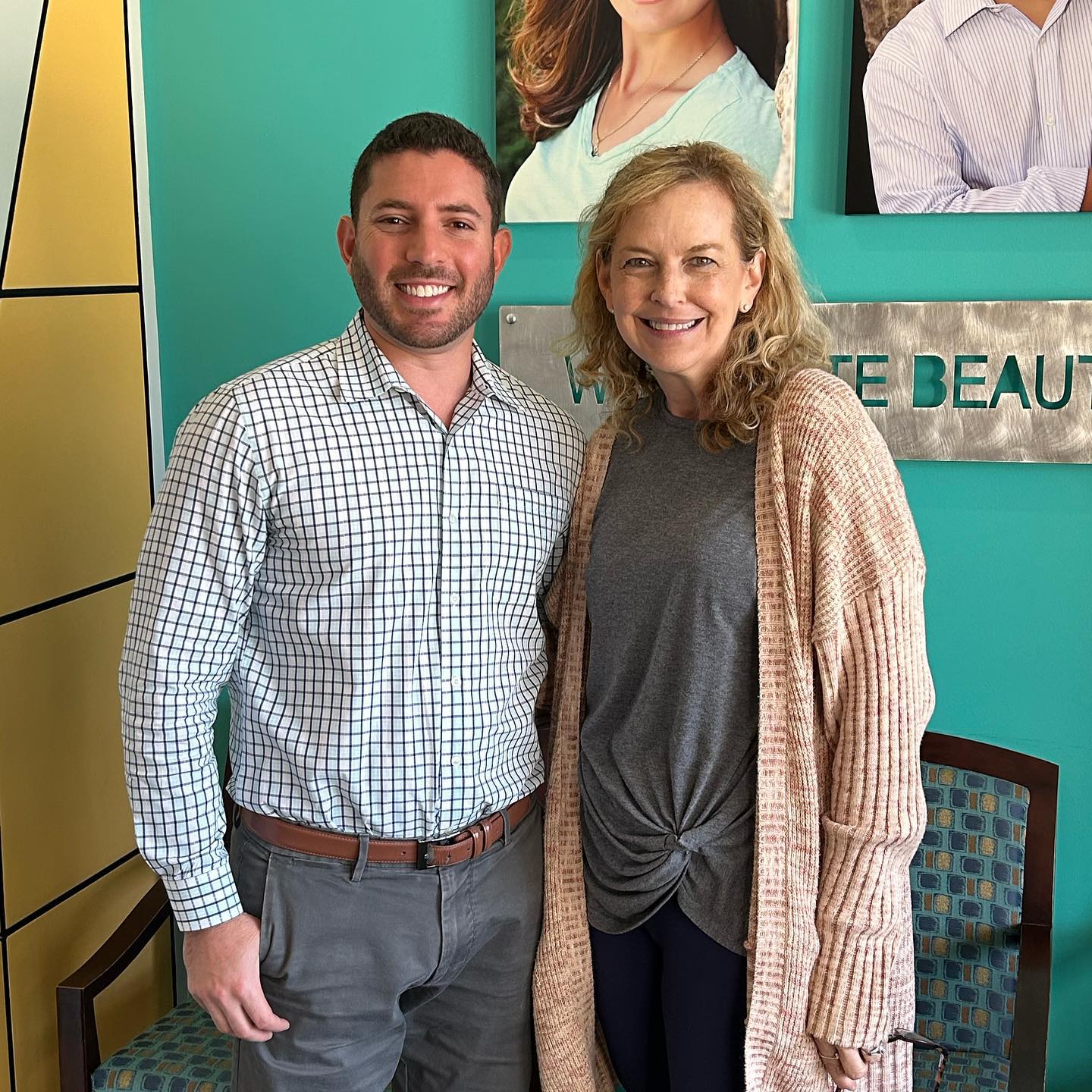 Ellen, a Murray Orthodontics Invisalign patient, smiling with Dr. Jonathan Murray after her smile transformation at the Palm Beach Gardens office.